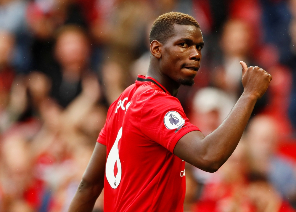 Manchester United's Paul Pogba gestures to the fans after the Premier League match against Chelsea during at Old Trafford, Manchester, Britain, on Sunday. — Reuters