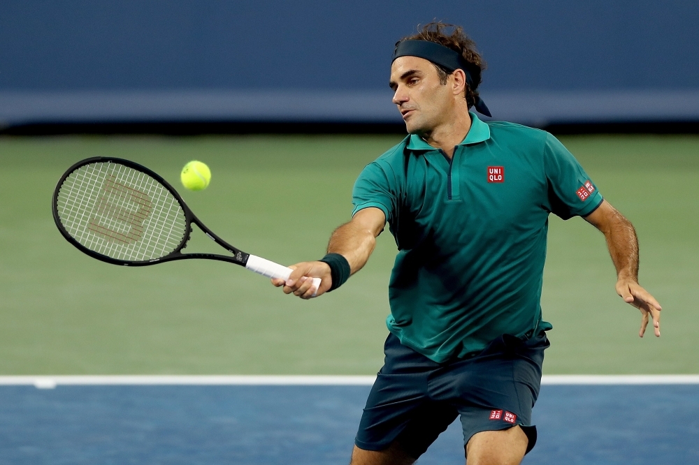 Roger Federer of Switzerland returns a shot to Juan Ignacio Londero of Argentina during the Western & Southern Open at Lindner Family Tennis Center in Mason, Ohio, on Tuesday. — AFP