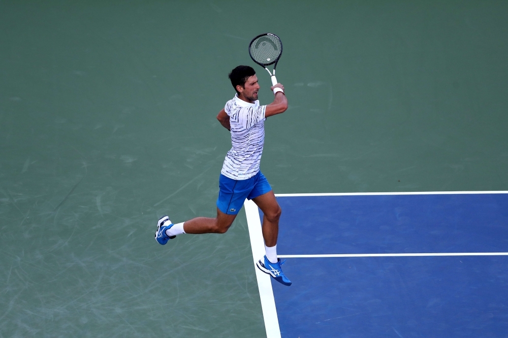 Roger Federer of Switzerland returns a shot to Juan Ignacio Londero of Argentina during the Western & Southern Open at Lindner Family Tennis Center in Mason, Ohio, on Tuesday. — AFP