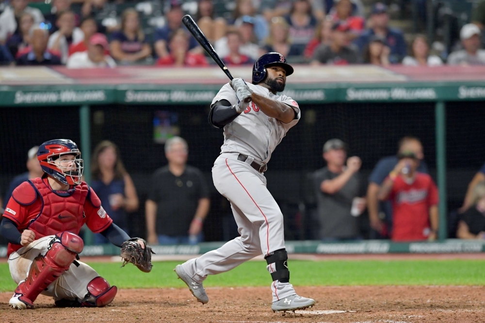 Jackie Bradley Jr. #19 of the Boston Red Sox hits a solo homer to take the lead during the tenth inning against the Cleveland Indians at Progressive Field in Cleveland, Ohio, on Tuesday. — AFP