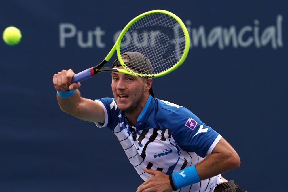 Jan-Lennard Struff (GER) returns a shot against Stefanos Tsitsipas (GRE) during the Western and Southern Open tennis tournament in Cincinnati, Ohio on Wednesday. -Reuters