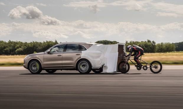 British cyclist Neil Campbell hits a speed record of more than 174mph to become the fastest man on bike. An attachment was fitted to the Porsche Cayenne in order to alter its aerodynamics. — Courtesy photo 