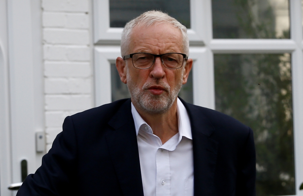 Britain's opposition Labour Party leader Jeremy Corbyn leaves his home in London on Monday. — Reuters