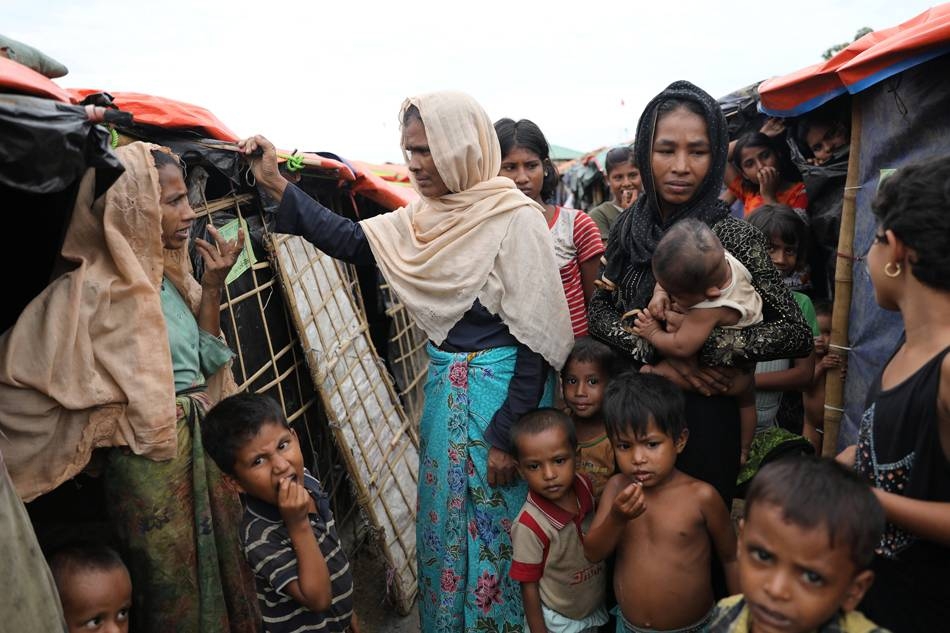 Rohingya refugee women and children gather at the Palong Khali refugee camp in Cox's Bazar, Bangladesh, in this Nov. 16, 2017 file photo. — Reuters