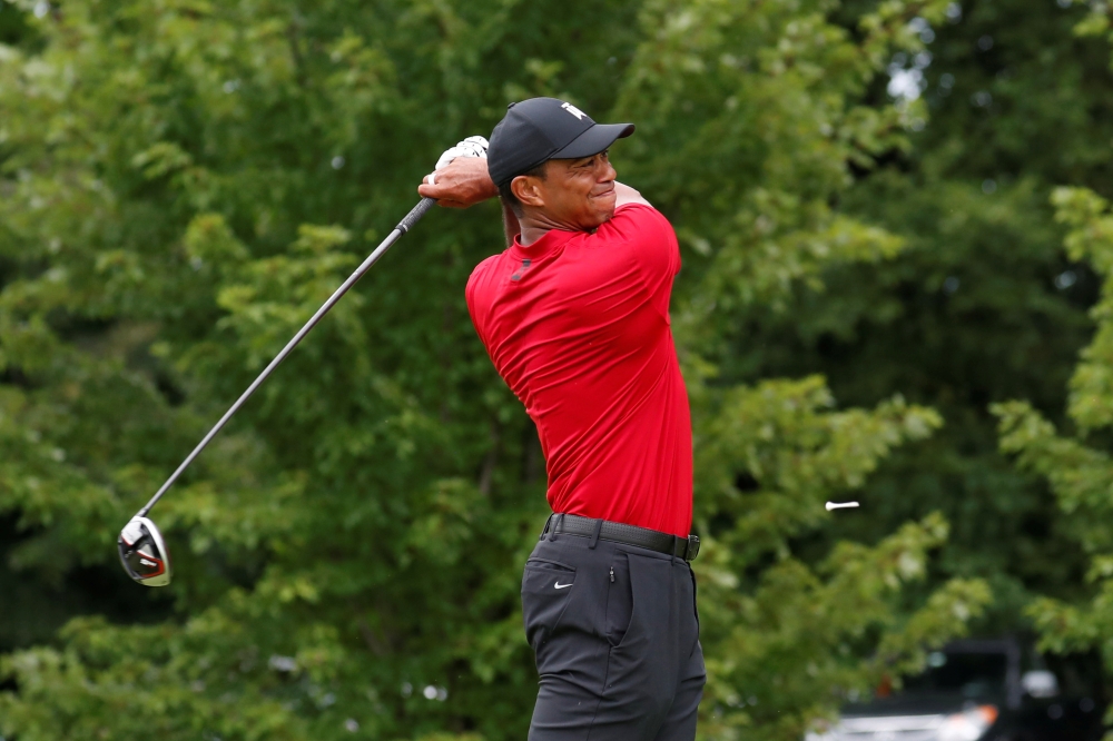 Tiger Woods hits his tee shot on the 5th hole during the final round of the BMW Championship golf tournament at Medinah Country Club No. 3 in Medinah, IL, USA, on Sunday. — Reuters