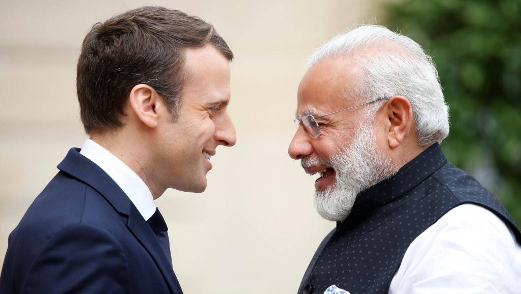 French President Emmanuel Macron greets visiting Indian Prime Minister Narendra Modi at the Elysée Palace in Paris in this file photo. — Reuters