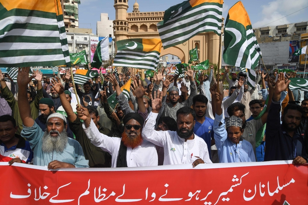 Supporters of the Tehreek-Labaik Pakistan (TLP) party shout slogans during an anti-Indian protest rally in Karachi on Tuesday, as they condemn India stripping the disputed Kashmir region of its special autonomy and imposing a lockdown two weeks ago. — AFP