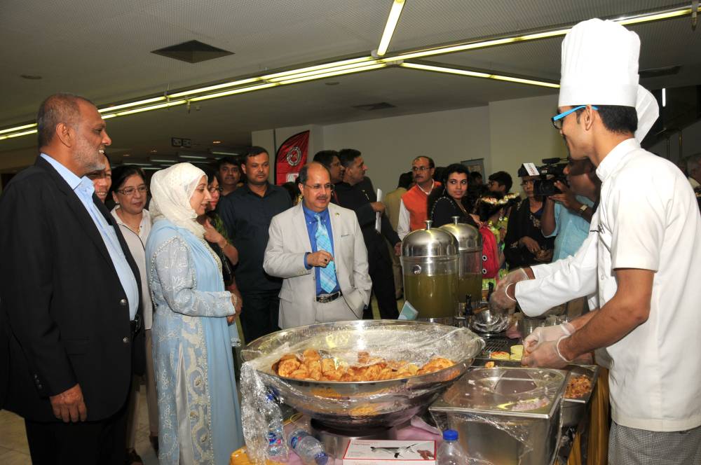 Ambassador Dr. Ausaf Sayeed and his wife at the food stall at 'India Day' event in Riyadh. — Courtesy photos