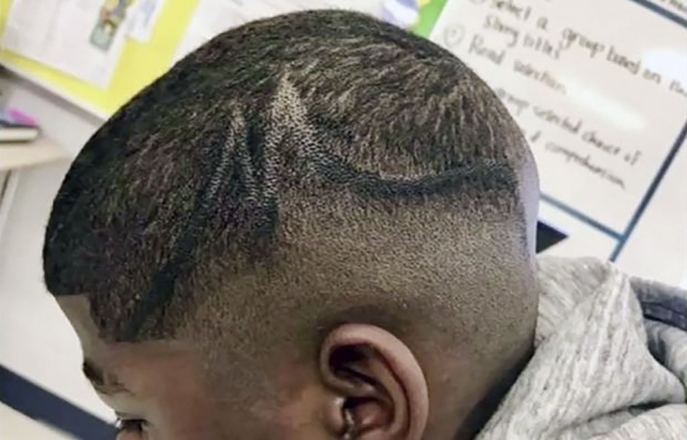 This undated unsourced handout photo obtained Aug. 20, 2019 courtesy of Kallinen Law PLCC in Houston, Texas, shows 13- year-old student identified at J.T. who was suspended from school due to his hairstyle. — AFP