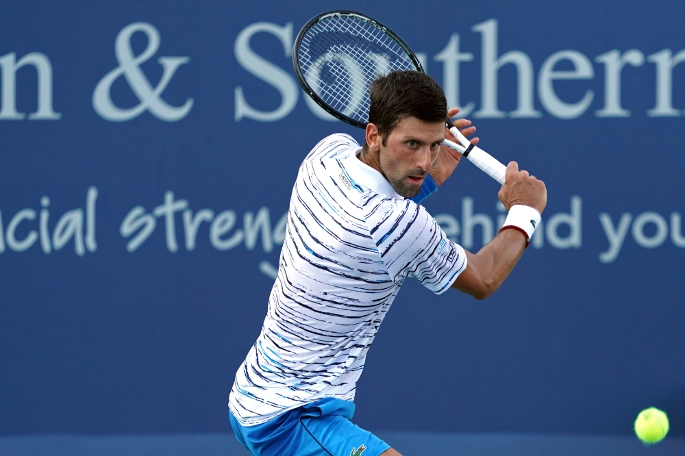 Novak Djokovic (SRB) returns a shot against Sam Querrey (USA) during the Western and Southern Open tennis tournament at Lindner Family Tennis Center, Mason, OH, USA, in this Aug. 13, 2019 file photo. — Reuters
