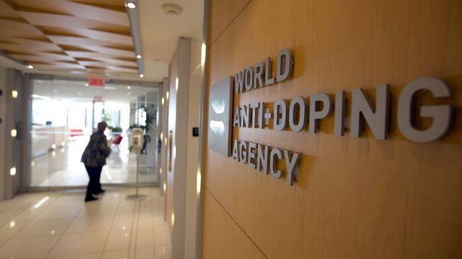 A woman walks into the head office of the World Anti-Doping Agency (WADA) in Montreal, Quebec, Canada, in this Nov. 9, 2015 file photo. — Reuters