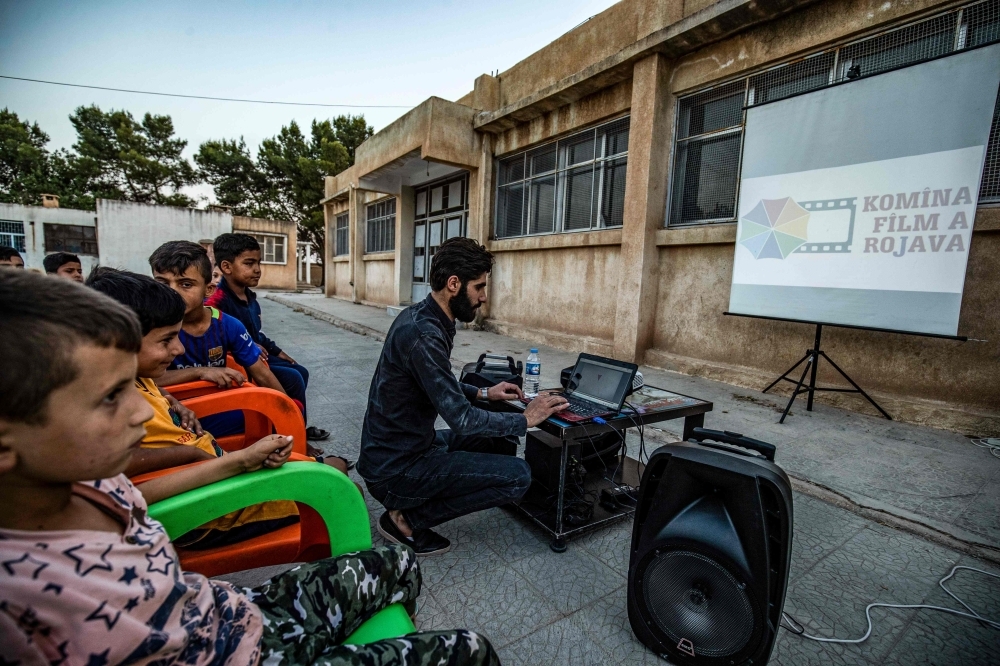 A member of Syrian-Kurdish filmmaker Shero Hinde's mobile cinema 