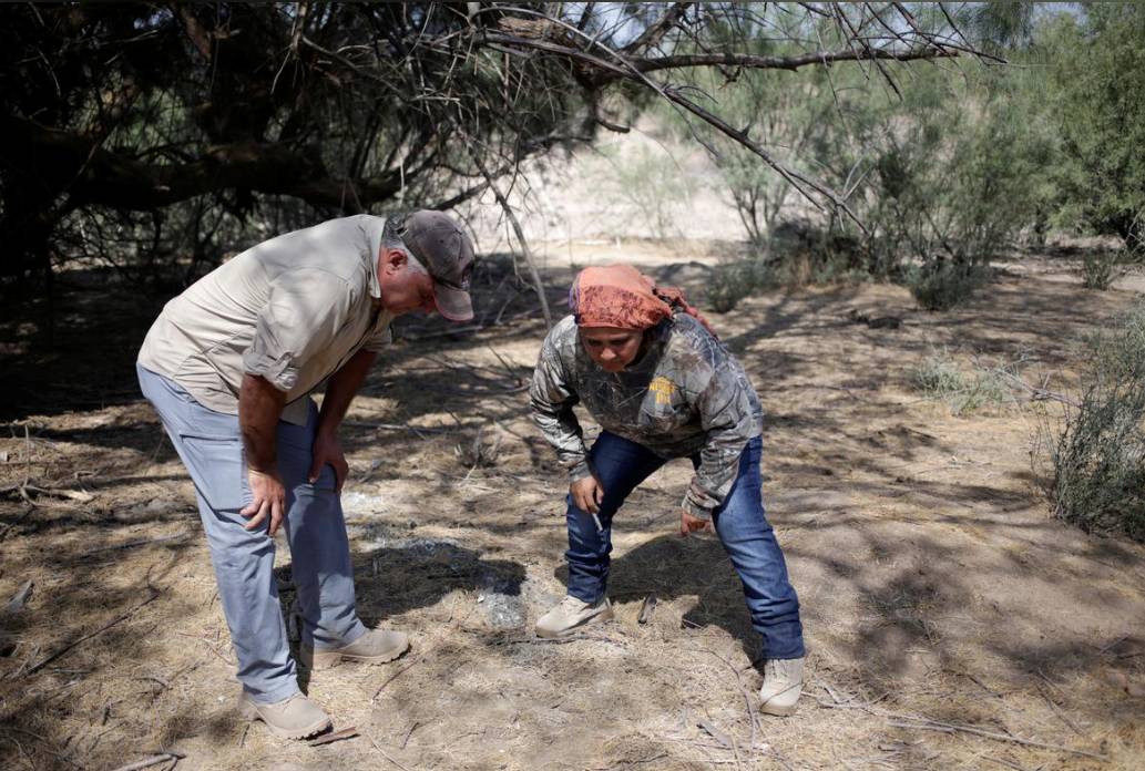 Silvia Ortiz and Oscar Sanchez, members of 'Grupo Vida', which recently opened a tortilla factory to cover the operating costs of their community-led forensic digs, take part in a search for human remains at a plot in the municipality of San Pedro, Mexico August 19, 2019. -Reuters