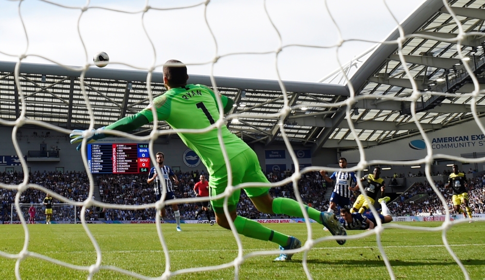 Southampton's Moussa Djenepo scores their first goal against Brighton & Hove Albion at the American Express Community Stadium, Brighton, Britain, on Saturday. — Reuters
