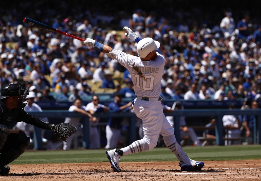 Justin Turner of the Los Angeles Dodgers hits a home run during the third inning of the MLB game against the New York Yankees at Dodger Stadium in Los Angeles, California, on Saturday. Teams are wearing special color-schemed uniforms with players choosing nicknames to display for Players' Weekend. — AFP