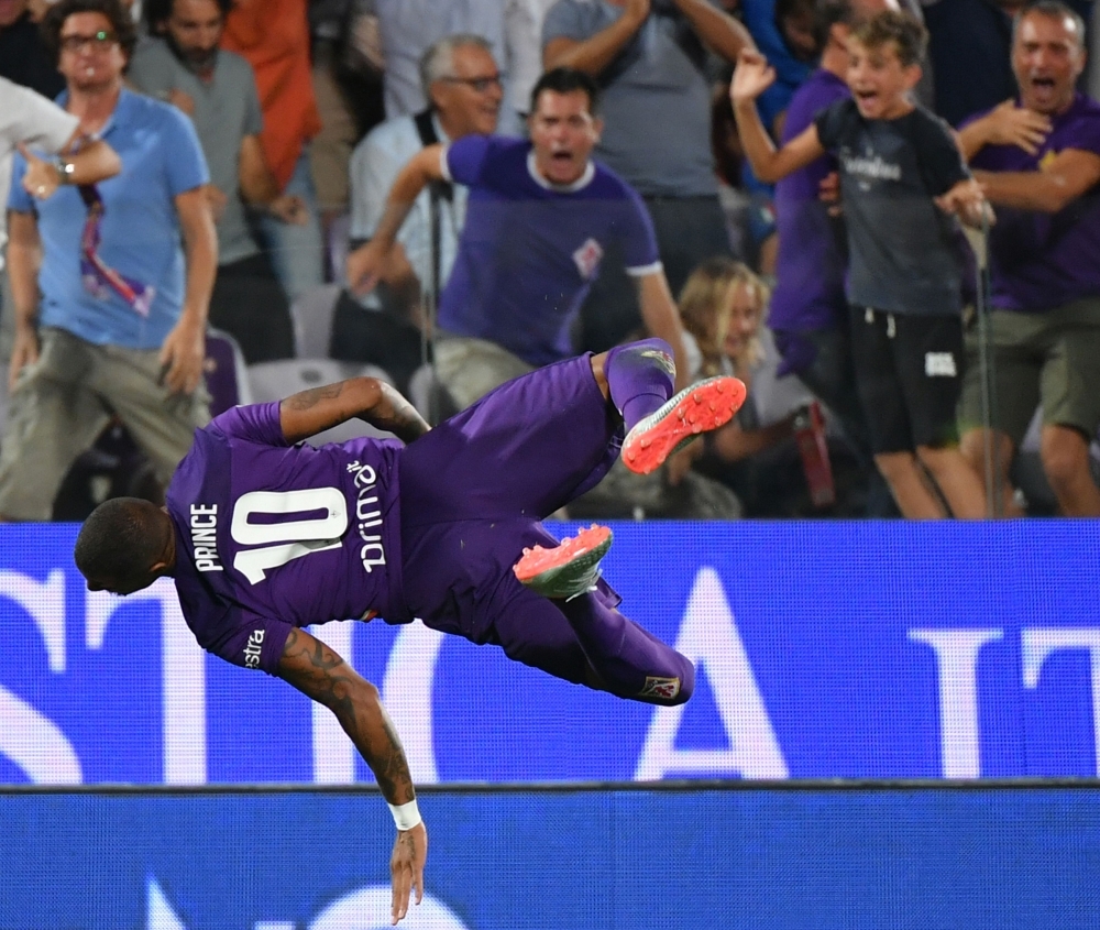 Fiorentina's Ghanaian forward Kevin-Prince Boateng performs a flip jump as he celebrates after scoring during the Italian Serie A football match Fiorentina vs Napoli at the Artemio-Franchi stadium in Florence, on Saturday. — AFP