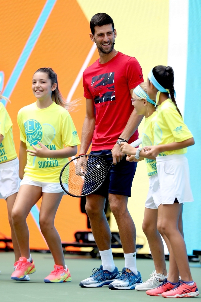 Novak Djokovic makes an appearance at the Arthur Ashe Kid's Day on center court at the USTA Billie Jean King National Tennis Center in New York City, NY, on Saturday. — AFP
