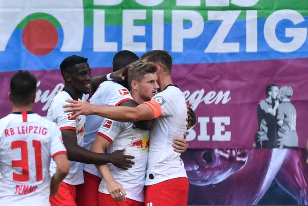 Leipzig's German forward Timo Werner (2nd R) celebrates after scoring the 1-0 during the German first division Bundesliga football match RB against Eintracht Frankfurt in Leipzig, eastern Germany, on Sunday. — AFP