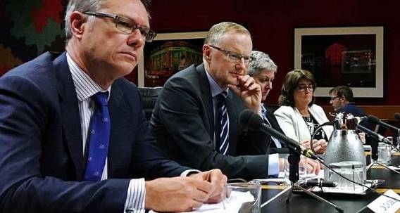 File photo of Reserve Bank of Australia Governor Philip Lowe (2nd L) as he speaks at a parliamentary committee hearing next to Deputy Governor Guy Debelle (L) in Sydney, Australia.  