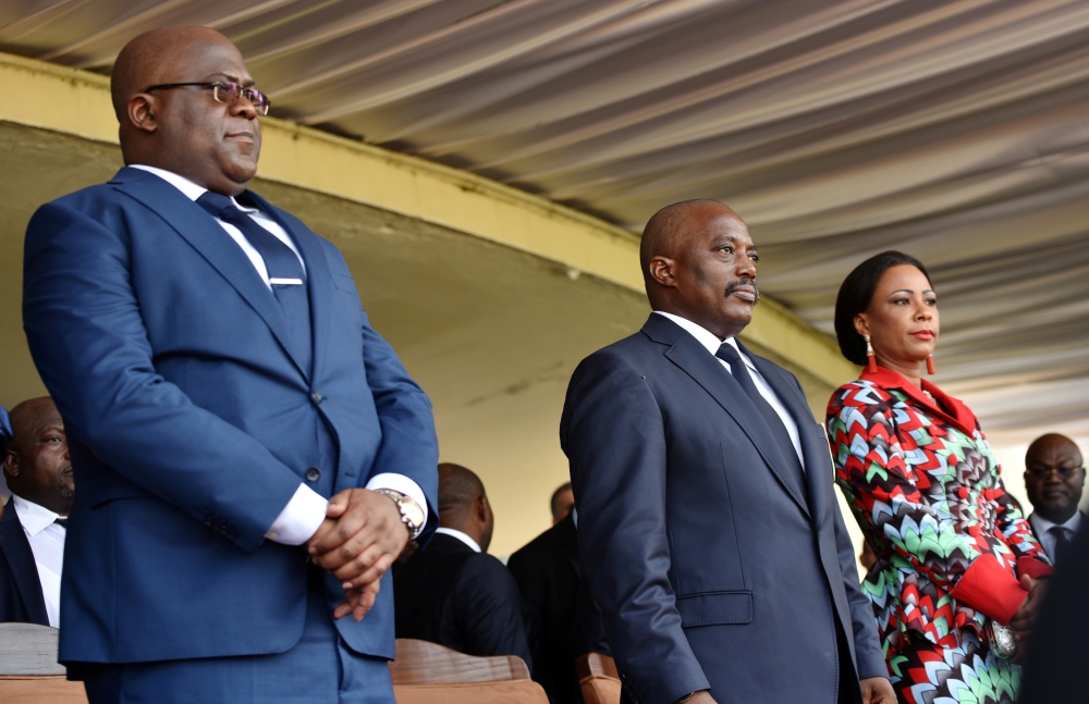 Democratic Republic of Congo's outgoing President Joseph Kabila and his successor Felix Tshisekedi take part in the latter's inauguration ceremony in Kinshasa, Democratic Republic of Congo January 24, 2019. -Reuters