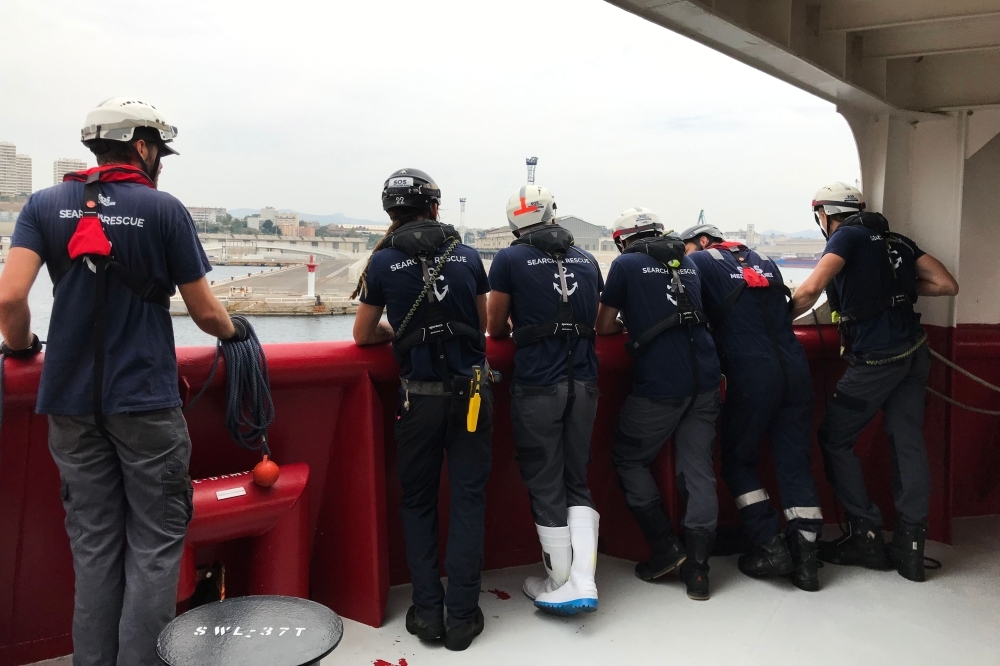 Members of the crew of the Ocean Viking rescue ship, jointly operated by French NGOs SOS Mediterranee and Medecins sans Frontieres (MSF - Doctors Without Borders), arrive in the port of Marseille, France, on Tuesday, after 23 days of search-and-rescue operation in the Mediterranean Sea. — AFP