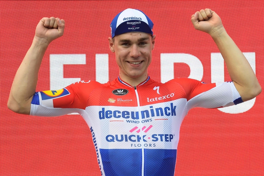 Team Deceuninck rider Netherlands' Fabio Jakobsen celebrates on the podium after winning the fourth stage of the 2019 La Vuelta cycling tour of Spain in El Puig, on Tuesday. — AFP