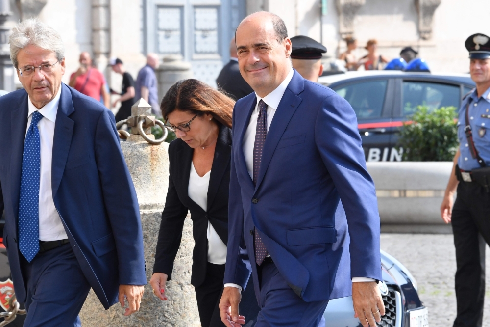 Former Prime Minister Paolo Gentiloni, left, Italian left-wing party leader of the Democratic Party (Partito Democratico - PD) Nicola Zingaretti, right, and vice secretary of the Italian Democratic Party (PD), Paola De Micheli arrive for a meeting with the Italian President as part of a second round of consultations with political parties at the Quirinal presidential palace in Rome, on Wednesday. — AFP