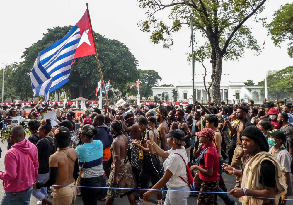 Papuans take part in a rally in front of the presidential palace and army headquarters in Jakarta on Wednesday. — AFP