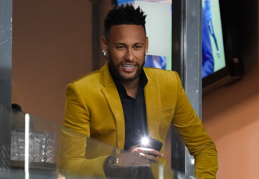 Brazil's injured football star Neymar is seen at the VIP area before the Copa America football tournament semi-final match between Brazil and Argentina at the Mineirao Stadium in Belo Horizonte, Brazil. (FILE PHOTO)