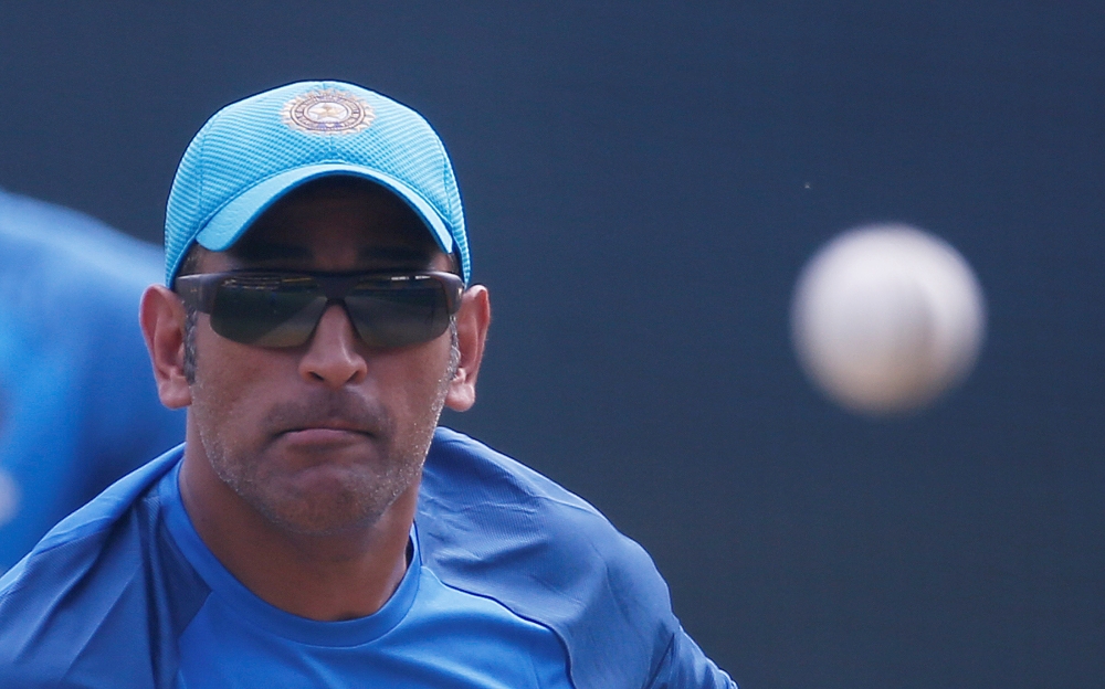 India's Mahendra Singh Dhoni bowls in the nets during team's practice session for the match against Australia at Indore, India, in this file photo. — Reuters