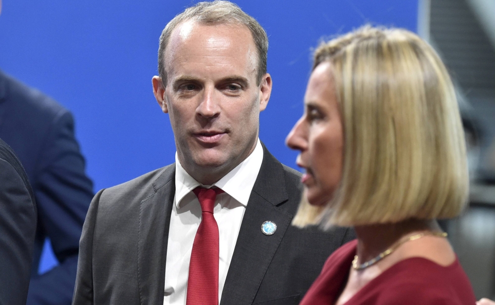 British Foreign Secretary Dominic Raab, left, speaks with EU foreign policy chief Federica Mogherini during the informal meeting of EU foreign ministers in Helsinki, Finland, on Thursday. — Reuters