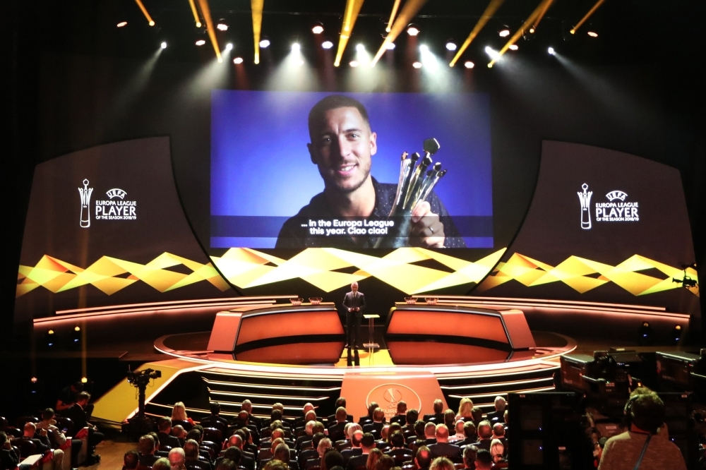 Belgian forward Eden Hazard is seen on screen as he is named Europa League Player of the Season during the UEFA Europa Cup football group stage draw ceremony in Monaco on Friday.  — AFP