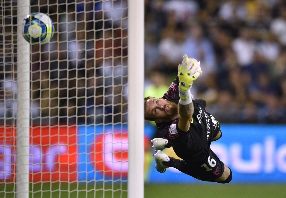 Metz' French Algerian goalkeeper Alexandre Oukidja concedes a goal during the French L1 football match between Metz (FCM) and Paris (PSG) at the Saint-Symphorien stadium in Longeville-les-Metz, eastern France, on Friday. — AFP