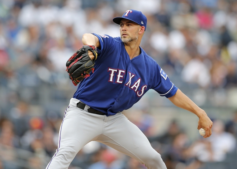 Mike Minor of the Texas Rangers pitches during the second inning against the New York Yankees at Yankee Stadiumin New York City, on Monday. — AFP