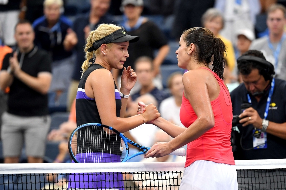Donna Vekic of Croatia shakes hands with Julia Goerges of Germany after their Women's Singles fourth round match on day eight of the 2019 US Open at the USTA Billie Jean King National Tennis Center in Queens borough of New York City, on Monday. — AFP