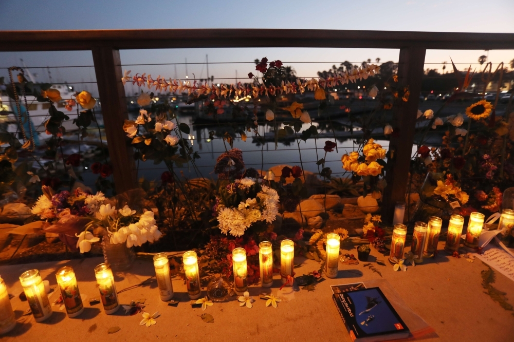 Candles are lit in Santa Barbara Harbor at a makeshift memorial for victims of the Conception boat fire on Tuesday in Santa Barbara, California. -Courtesy photo