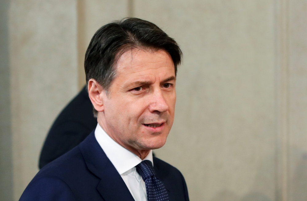Italian Prime Minister Giuseppe Conte arrives to speak to the media at the Quirinale Presidential Palace after a meeting with Italian President Sergio Mattarella in Rome, Italy, on Wednesday. — Reuters