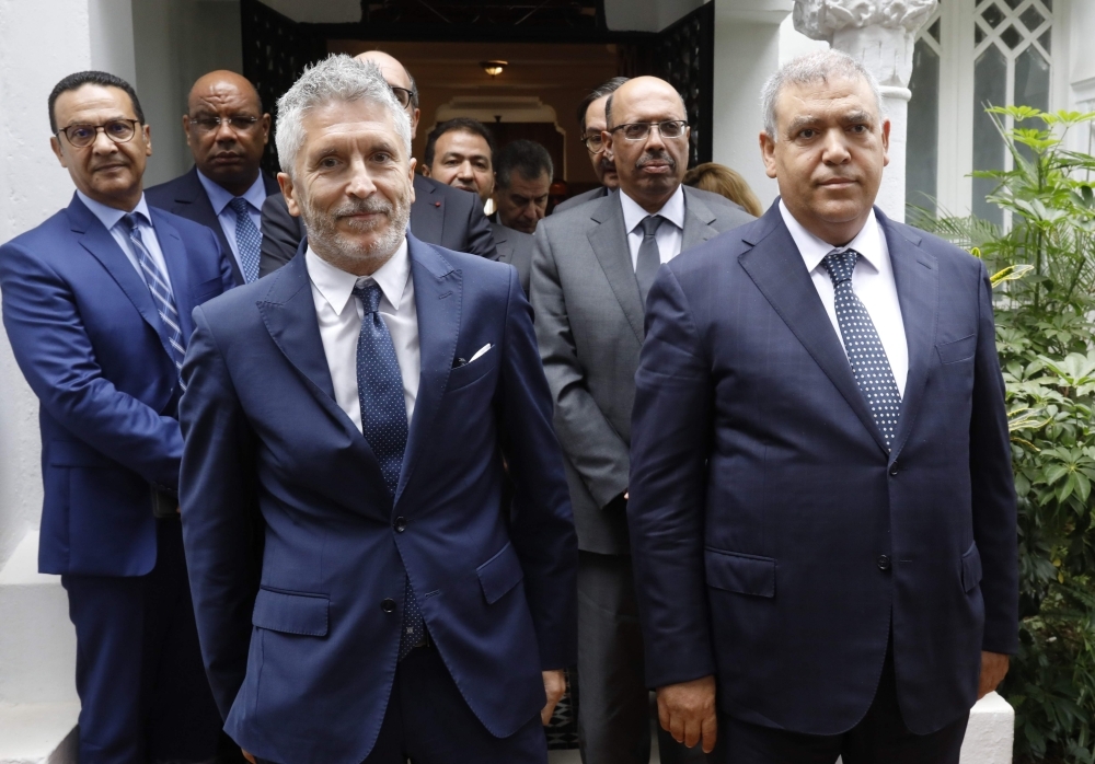 Moroccan Interior Minister Abdelouafi Laftit, right and his Spanish counterpart Fernando Grande-Marlaska  pose for a picture following a meeting in Rabat on Wednesday. — AFP