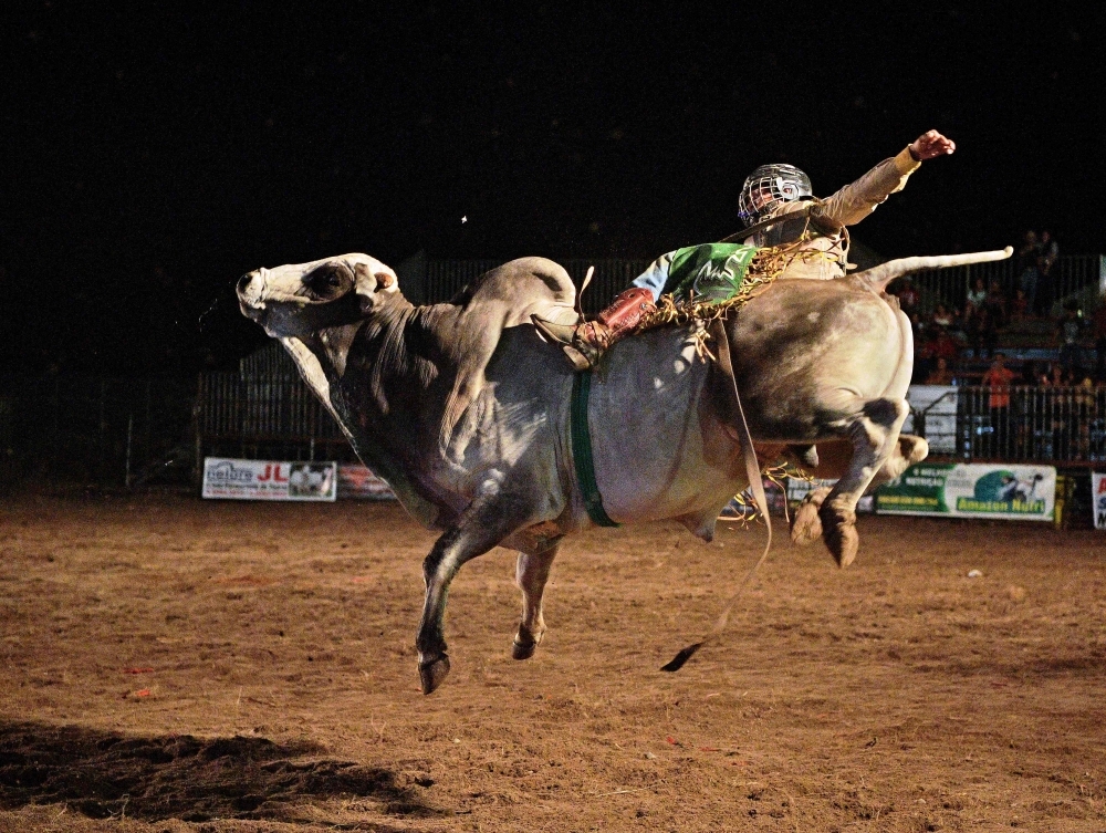 A rider competes during a rodeo event in Monte Negro, south of the Amazon basin, Rondonia state, Brazil, in this Aug. 30, 2019 file photo. In recent years, Monte Negro has expanded as a key cattle town with a strong cowboy culture. — AFP