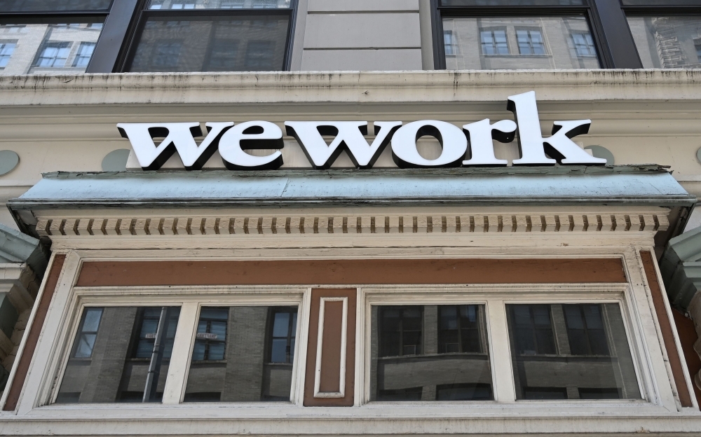 In this file photo a WeWork office is seen in New York City.  WeWork has slashed by more than half its valuation target after setting an ambitious goal for the fast-growing office-sharing startup, sources familiar with the company said on Thursday. — AFP
