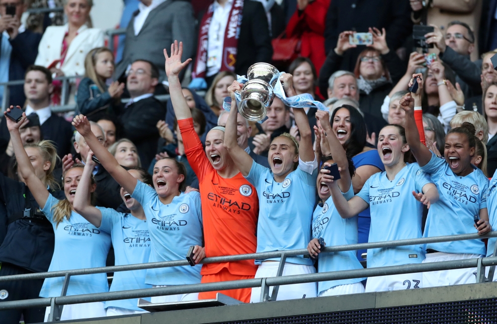 Manchester City's Steph Houghton lifts the trophy as she celebrates with teammates after winning the Women's FA Cup against West Ham United at the Wembley Stadium, London, Britain on May 4, 2019. — Reuters