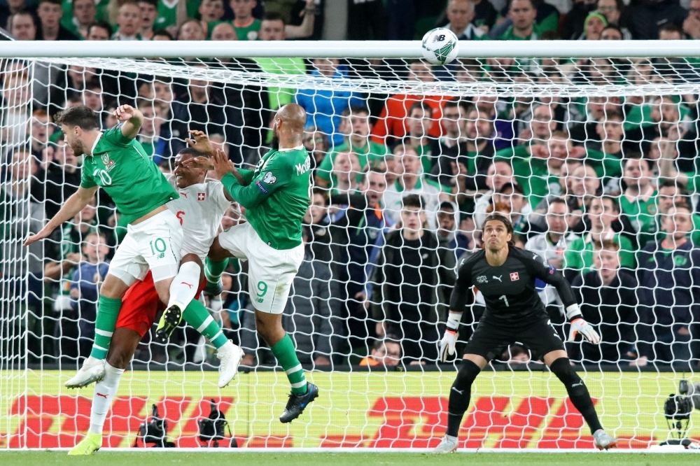 Republic of Ireland's striker David McGoldrick (C) climbs to head home the Irish equalizer during the Euro 2020 football qualification match between Republic of Ireland and Switzerland at Aviva Stadium in Dublin, Ireland on Thursday. The game finished 1-1. — AFP 