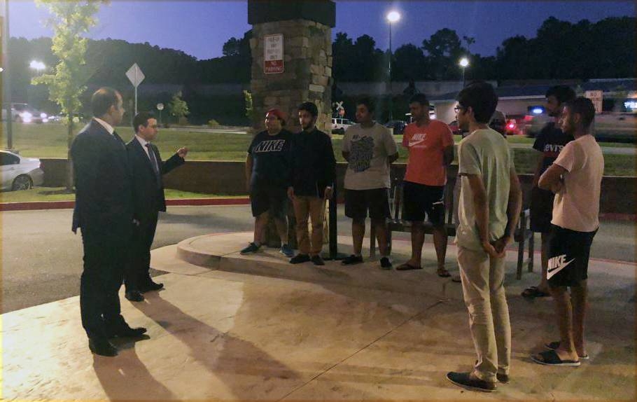 Majed Abul Ula, the head of the Saudi Affairs Department at the Kingdom’s Consulate in Houston, along with evacuated Saudis.