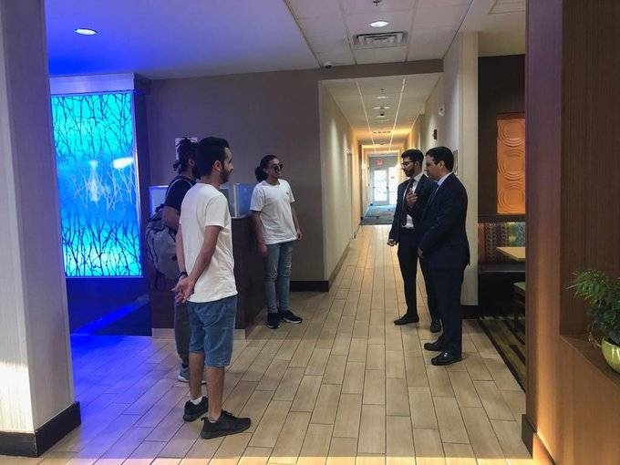 Majed Abul Ula, the head of the Saudi Affairs Department at the Kingdom’s Consulate in Houston, along with evacuated Saudis.