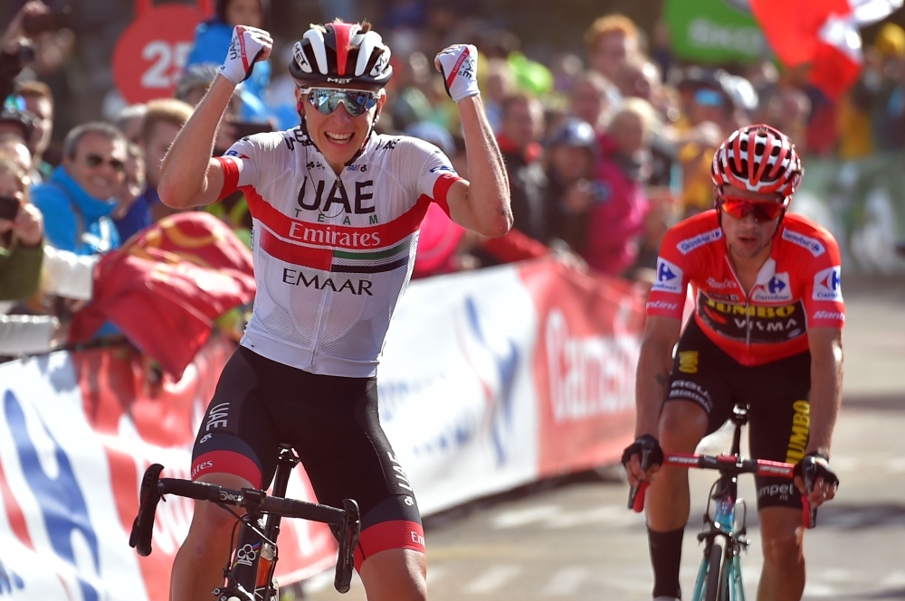 Team UAE Emirates rider Slovenia's Tadej Pogacar (L) crosses the finish line followed by Team Jumbo rider Slovenia's Primoz Roglic during the 13th stage of the 2019 La Vuelta cycling Tour of Spain, a 166,4 km race from Bilbao to Los Machucos on Friday. — AFP