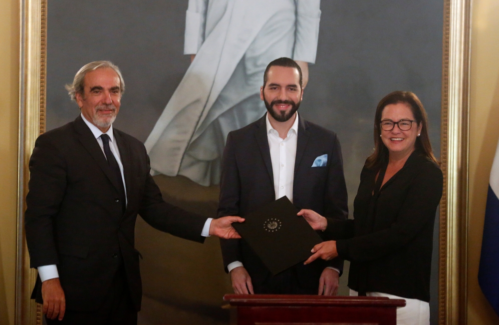 El Salvador's President Nayib Bukele signs an agreement with Luis Porto, special envoy of the Organization of American States (OAS), and Foreign Affairs Minister Alexandra Hill to create the International Commission against Impunity in El Salvador (CICIES), in San Salvador, El Salvador on Friday. -Reuters
