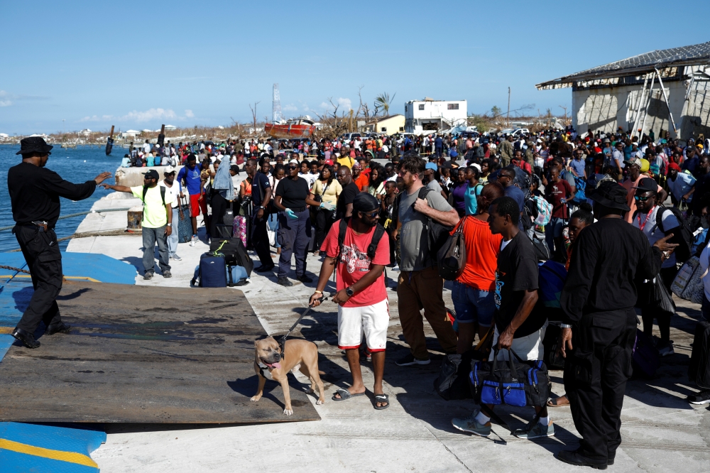 People get in a ferry at Marsh Harbour Government Port during an evacuation operation after Hurricane Dorian hit the Abaco Islands in Marsh Harbor, Bahamas, on Friday. -Reuters
