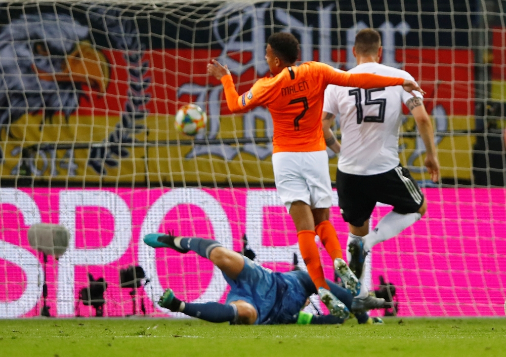 Netherlands' Donyell Malen scores their third goal against Germany during Euro 2020 Qualifier Group C match at Volksparkstadion, Hamburg, Germany, on Friday. — Reuters