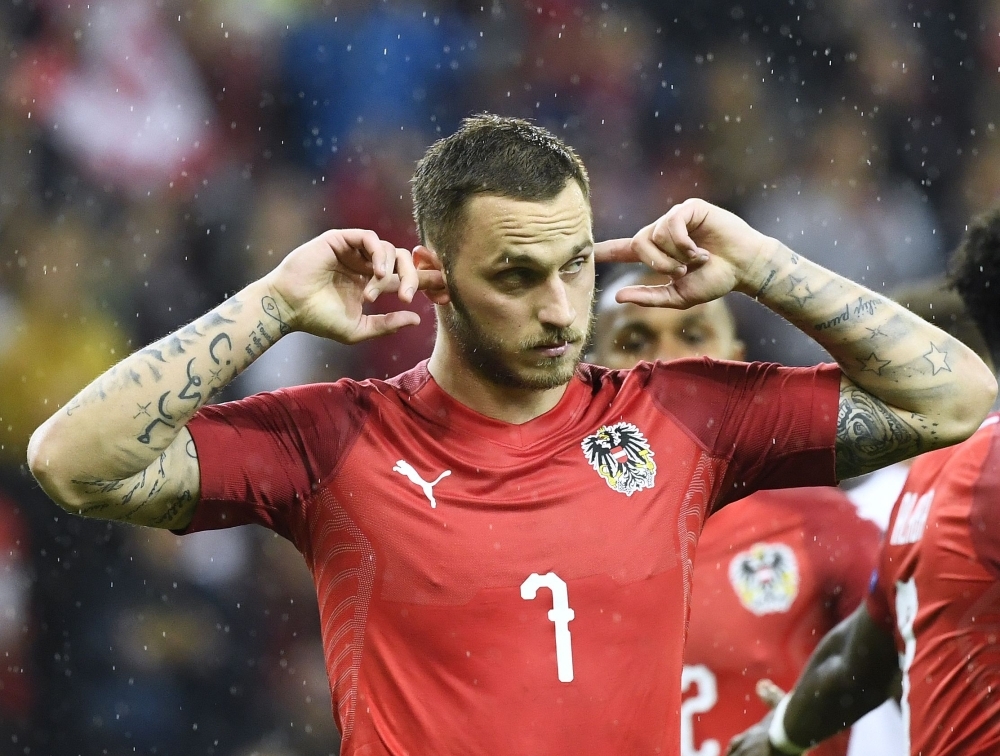 Austria's Forward Marko Arnautovic celebrate scoring during the UEFA Euro 2020 qualification football match between Austria and Latvia in Salzburg, Austria, on Friday. — AFP