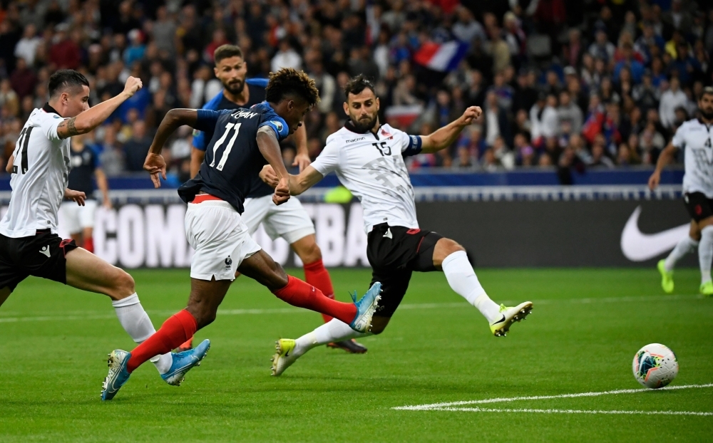France's forward Kingsley Coman (blue jersey) scores a goal during the UEFA Euro 2020 qualifying Group H football match between France and Albania at the Stade de France stadium in Paris, on Saturday. — AFP